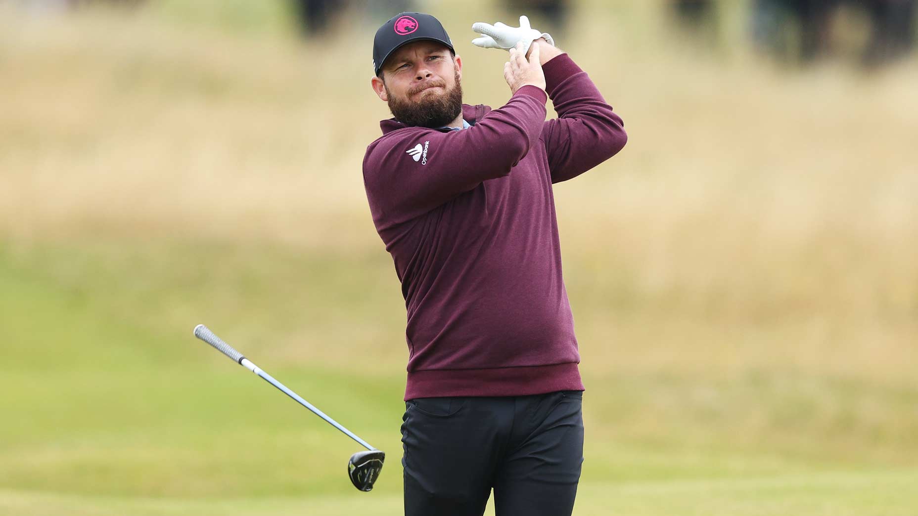 Tyrrell Hatton drops a club after a swing at the Open.