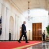 President Biden walks through the Cross Hall of the White House on July 1, 2024.