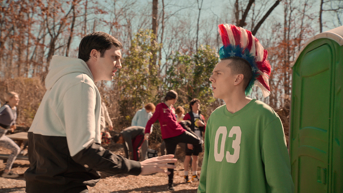 Gianni DeCenzo as Demetri and Jacob Bertrand as Eli 'Hawk' Moskowitz face each other during trainig in the woods in Season 6 of ‘Cobra Kai’