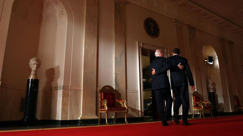 Biden and Obama put their arms around each other after Obama's health care overhaul was passed in March 2009. It was the biggest expansion of health care guarantees in more than four decades, and it represented a significant step toward the goal of universal coverage, which had been sought by every Democratic President since Harry Truman.