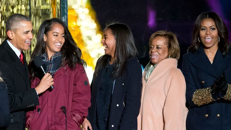 President Barack Obama, left, with daughters Malia and Sasha, mother-in-law Marian Robinson and first lady Michelle Obama sing onstage during the National Christmas Tree Lighting ceremony at the Ellipse in Washington, Thursday, Dec. 3, 2015. Also on stage is actress Reese Witherspoon at left. (AP Photo/Pablo Martinez Monsivais)


