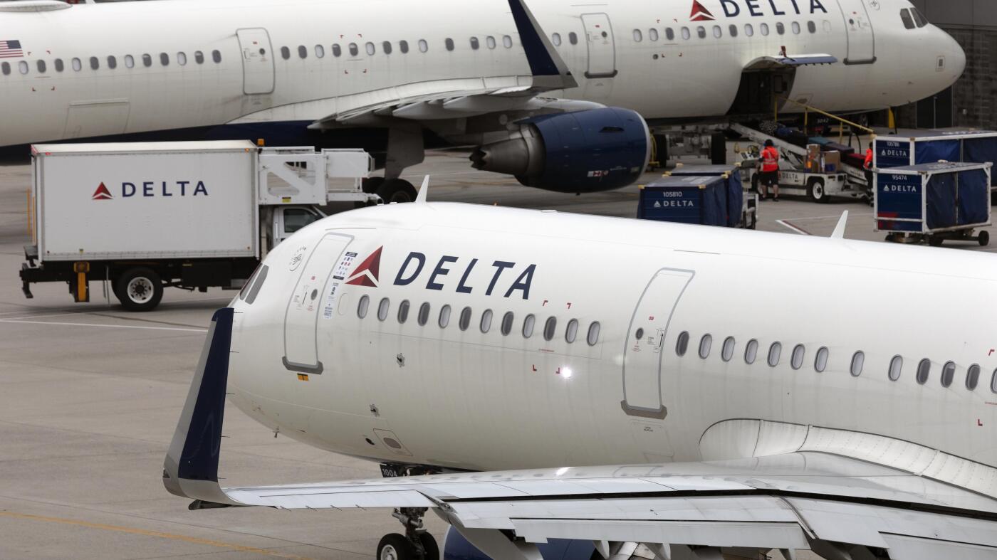 Delta's flight delays and cancellations prompt Dept. of Transportation investigation : NPR