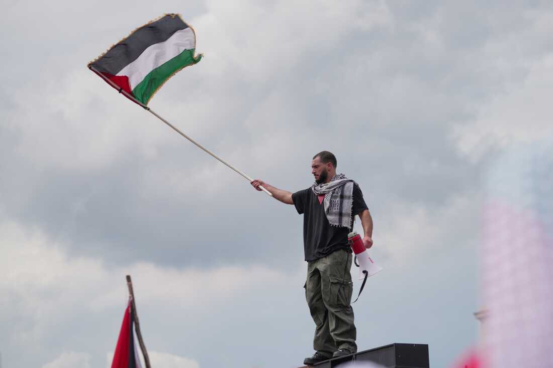 A pro-Palestinian protestor standing outside of the U.S. Capitol to protest Israeli Prime Minister Benjamin Netanyahu's speech to the United States Congress in Washington, DC on July 24, 2024.