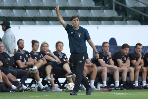 AFC Bournemouth head coach Adoni Iraola, center, reacts on the...