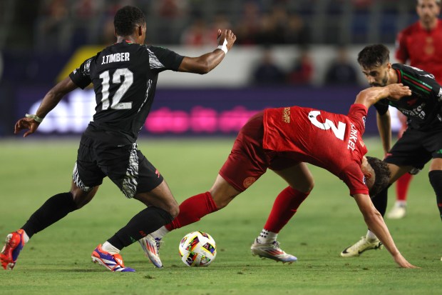 AFC Bournemouth defender Milos Kerkez (3) tries to recover the...