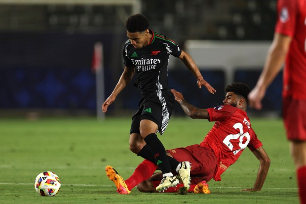 Arsenal’s Ethan Nwaneri, left, is tackled by AFC Bournemouth midfielder...