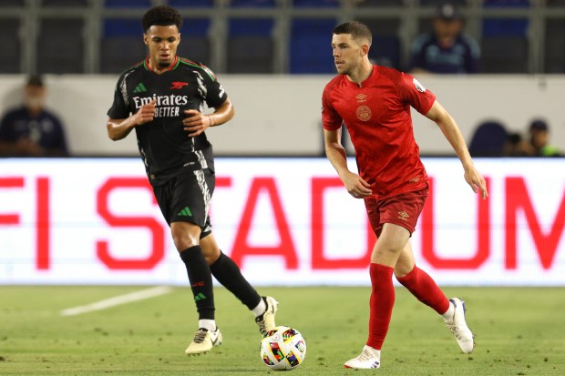 AFC Bournemouth midfielder Ryan Christie, right, moves the ball during...