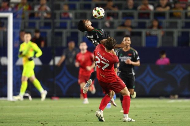 Arsenal forward Gabriel Jesus, center top, vies for the ball...