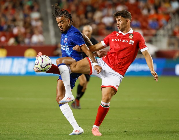 Chelsea FC's Wesley Fofana (29) fights for the ball against...