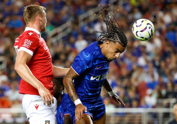 Chelsea FC's Malo Gusto (27) heads the ball against Wrexham...