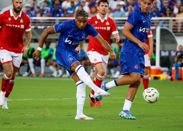 Chelsea FC's Christopher Nkunku (18) scores a goal against Wrexham...