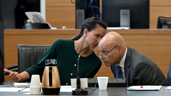 Ashley Benefield whispers to her attorney, Neil Taylor, as she appears before potential jurors in the voir dire portion of her trial for the second-degree murder of her estranged husband in 2020 at the Manatee County Judicial Center, July 22, 2024.