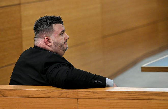 Paralegal Jack O’Keefe sits behind the defense table as Ashley Benefield appears before potential jurors in the voir dire portion of her trial for the second-degree murder of her estranged husband in 2020 at the Manatee County Judicial Center, July 22, 2024.