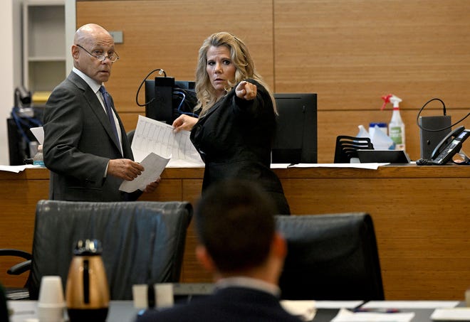 Ashley Benefield’s attorney Neil Taylor and Assistant State Attorney Suzanne O’Donnell speak before selecting potential jurors in the voir dire portion of Benefield’s trial for the second-degree murder of her estranged husband in 2020 at the Manatee County Judicial Center, July 22, 2024.