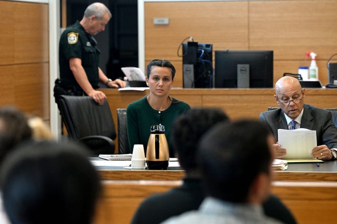 Ashley Benefield sits with her attorney Neil Taylor as she appears before potential jurors in the voir dire portion of her trial for the second-degree murder of her estranged husband in 2020 at the Manatee County Judicial Center, July 22, 2024.