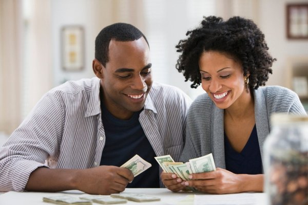 A couple counting lots of cash.