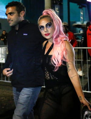 Lady Gaga and Michael Polansky leave after the game during Super Bowl LIV in Miami Gardens, Florida, Feb. 2, 2020.