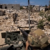 Members of the Lebanese army and the Italian contingent of the UNIFIL peacekeeping force inspect a house destroyed by an Israeli attack during a patrol in Yarine on June 10.