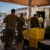 Soldiers and civilians enter a rocket shelter as sirens sound in the Israeli town of Kiryat Shmona on the Lebanon border on June 10, 2024.