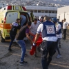 Israeli security forces and medics transport casualties along with local residents, at a site where a reported strike from Lebanon fell in Majdal Shams village in the Israeli-controlled Golan Heights area on Saturday.