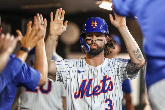 Jul 29, 2024; New York City, New York, USA; New York Mets right fielder Jesse Winker (3) is greeted in the dugout after scoring a run in the fourth inning against the Minnesota Twins at Citi Field. Mandatory Credit: Wendell Cruz-USA TODAY Sports