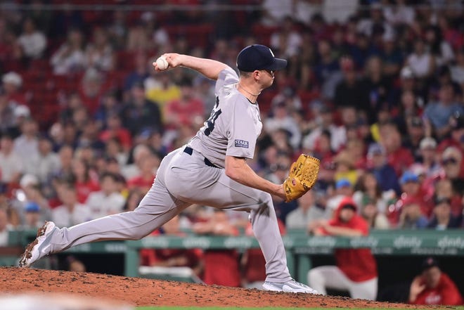 Jul 28, 2024; Boston, Massachusetts, USA; New York Yankees pitcher Caleb Ferguson (64) pitches against the Boston Red Sox during the eighth inning at Fenway Park. Mandatory Credit: Eric Canha-USA TODAY Sports