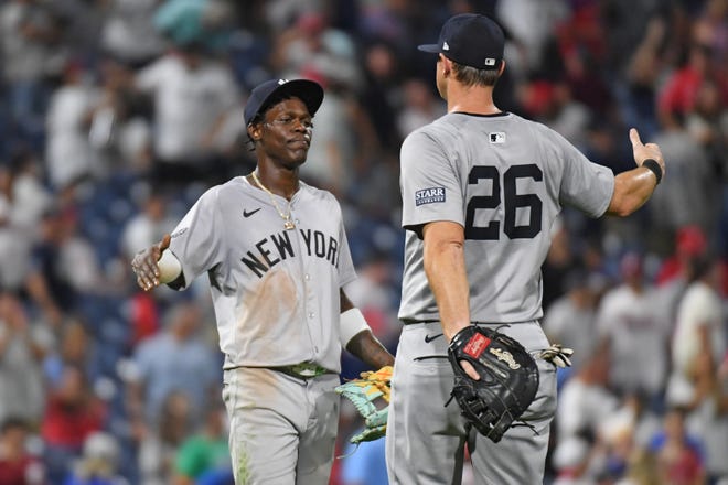 Jul 29, 2024; Philadelphia, Pennsylvania, USA; New York Yankees third baseman Jazz Chisholm, Jr (13) and New York Yankees third base DJ LeMahieu (26) celebrate win against the Philadelphia Phillies at Citizens Bank Park. Mandatory Credit: Eric Hartline-USA TODAY Sports