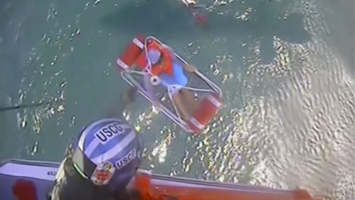 5 boaters found clinging to a cooler in Lake Erie are rescued by a Coast Guard helicopter crew