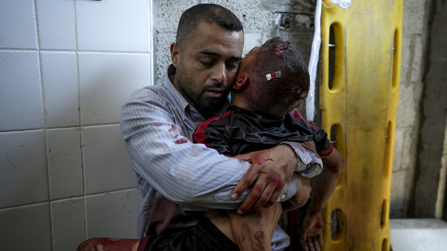 A boy in Gaza was killed by an Israeli airstrike. His father held him and wouldn't let go