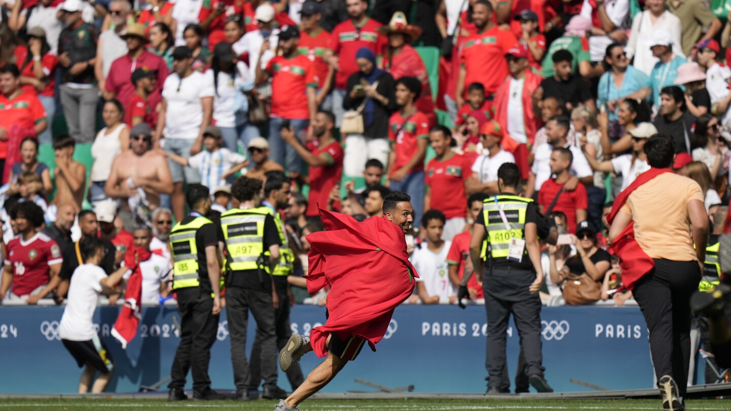 Argentina vs. Morocco: Fans rush pitch during Olympics soccer match