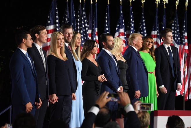 (From R) Barron Trump, First Lady Melania Trump, US President Donald Trump, Tiffany Trump, Donald Trump Jr., Kimberly Guilfoyle, Lara Trump, Eric Trump, Ivanka Trump, Jared Kushner and Michael Boulos stand after the president delivered his acceptance speech for the Republican Party nomination for reelection during the final day of the Republican National Convention at the South Lawn of the White House in Washington, DC on August 27, 2020. (Photo by SAUL LOEB / AFP) (Photo by SAUL LOEB/AFP via Getty Images)