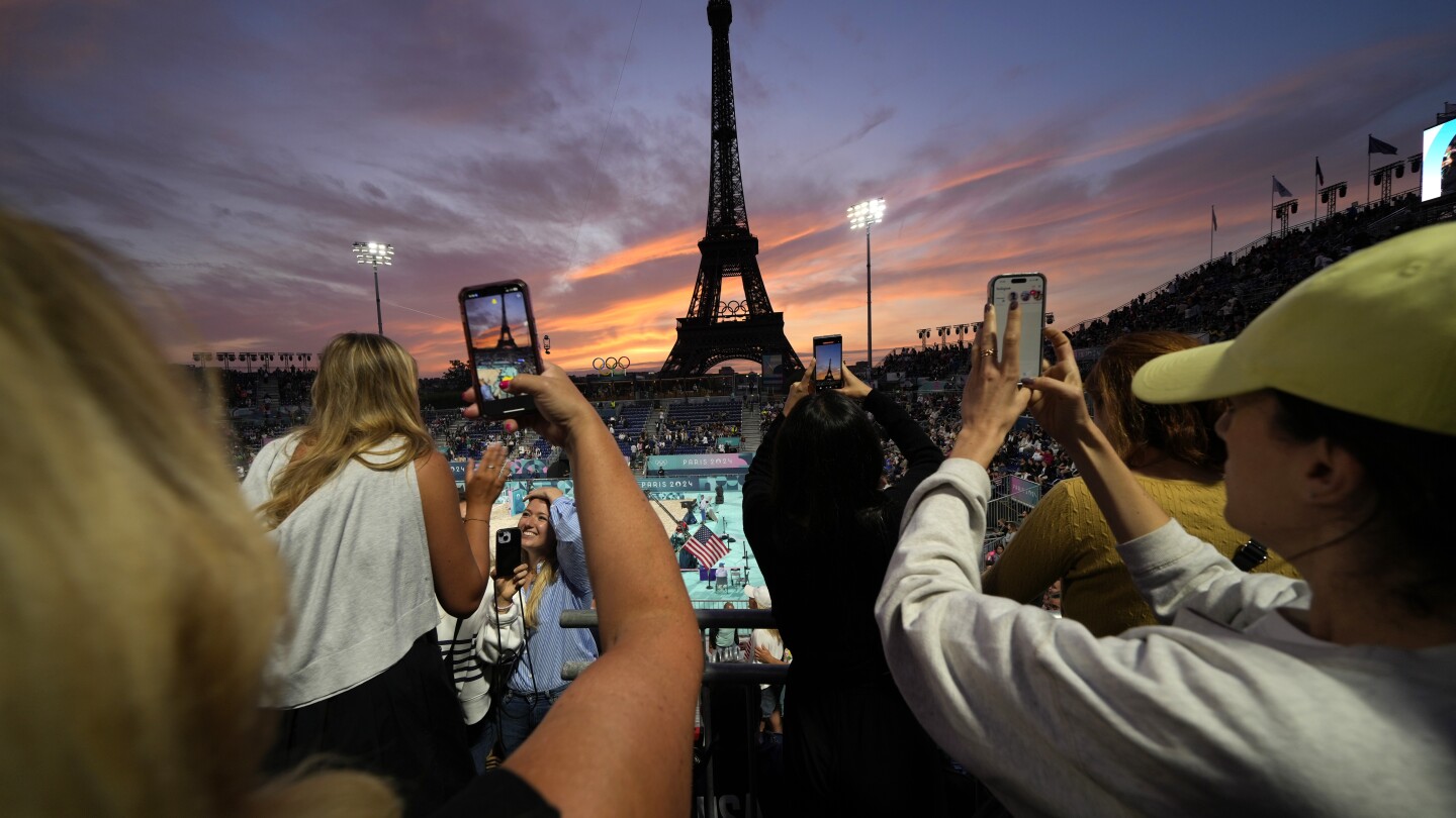 Beach volleyball at Eiffel Tower stadium draws the crowds looking for the perfect social media post