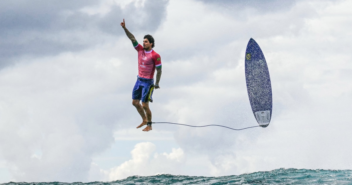 Brazilian surfer's historic ride at the Olympics spawns iconic photo