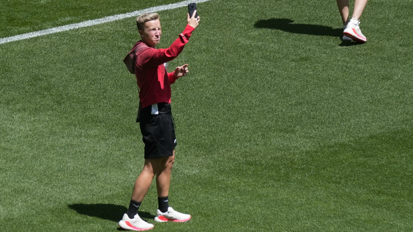 Canada women's soccer coach will step aside for the team's opener because of drone incidents