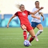 New Zealand midfielder Macey Fraser (right) and Canada forward Janine Beckie fight for the ball during the group match at the Paris 2024 Olympic Games in Saint-Etienne on Thursday.