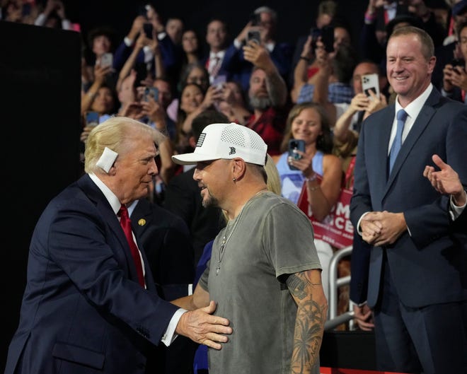 Republican presidential nominee Donald Trump with Jason Aldean during the final day of the Republican National Convention at the Fiserv Forum. The final day of the RNC featured a keynote address by Republican presidential nominee Donald Trump.