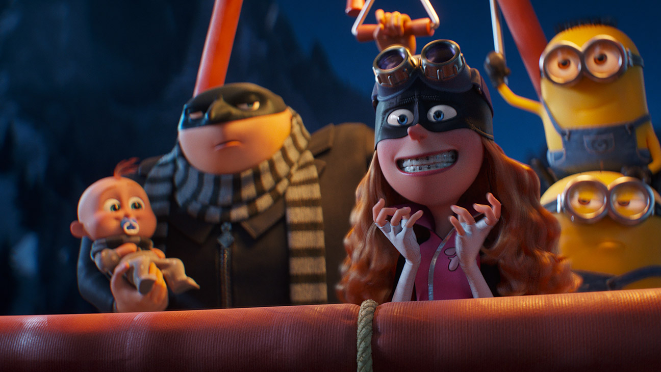 (from left) Gru Jr., Gru (Steve Carell), Poppy Prescott (Joey King) and Minions (Pierre Coffin) in Despicable Me 4, directed by Chris Renaud.