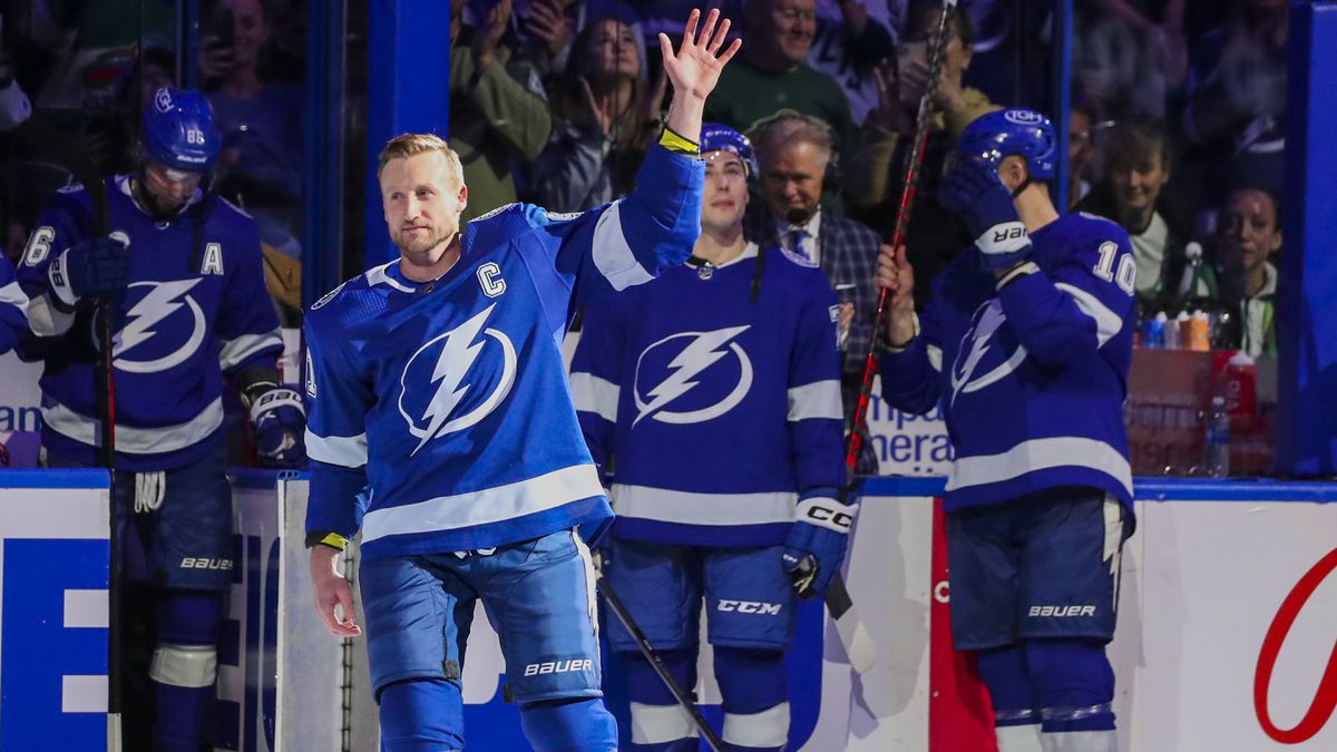 Steven Stamkos hoists the Stanley Cup as his team cheers after defeating the Montreal Canadiens in the Stanley Cup Final in 2021.