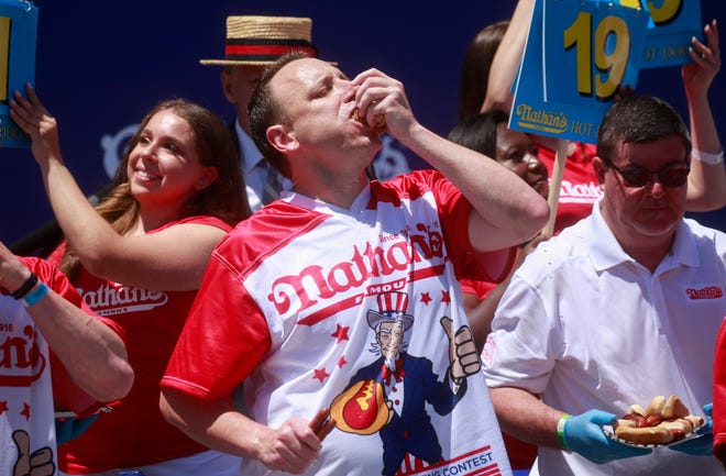 July 4: Joey Chestnut eats hot dogs during the 2022 Nathans Famous Fourth of July International Hot Dog Eating Contest on July 4, 2022 at Coney Island in the Brooklyn borough of New York City. The contest, which has happened every year since 1972, has returned in front of Nathan’s Famous on Surf Avenue this year.