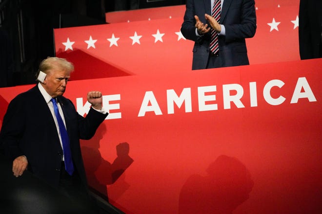 Former President Donald Trump walks down from the family box at the Republican National Convention.