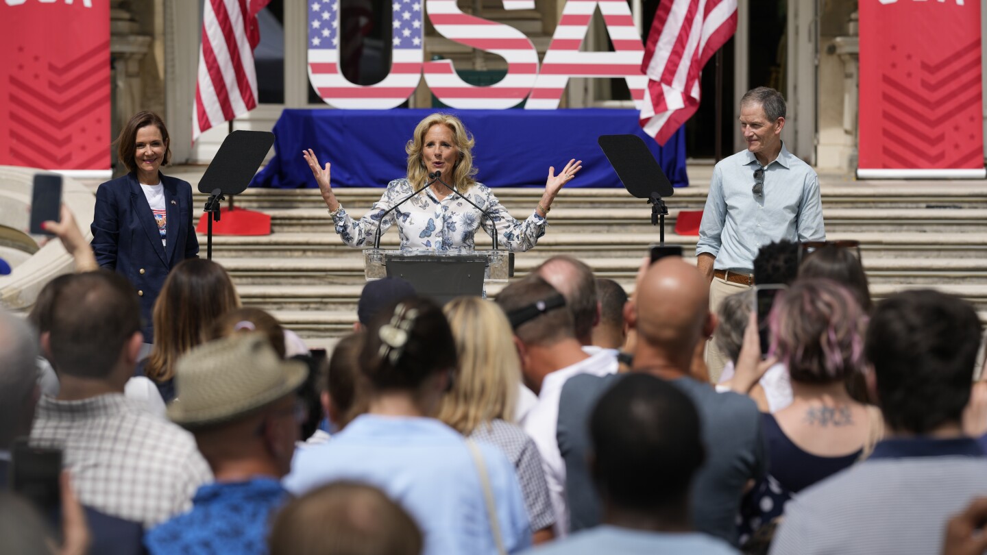 Jill Biden meets with US Olympic athletes in Paris — and even helps with a relay drill