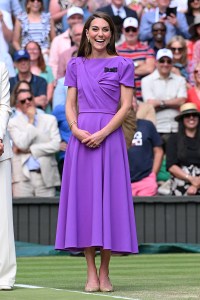 Kate Middleton wearing Safiyaa purple dress at Wimbledon 2024, 
 LONDON, ENGLAND - JULY 14: Catherine Princess of Wales on court to present the trophy to the winner of the men's final on day fourteen of the Wimbledon Tennis Championships at the All England Lawn Tennis and Croquet Club on July 14, 2024 in London, England. (Photo by Karwai Tang/WireImage)