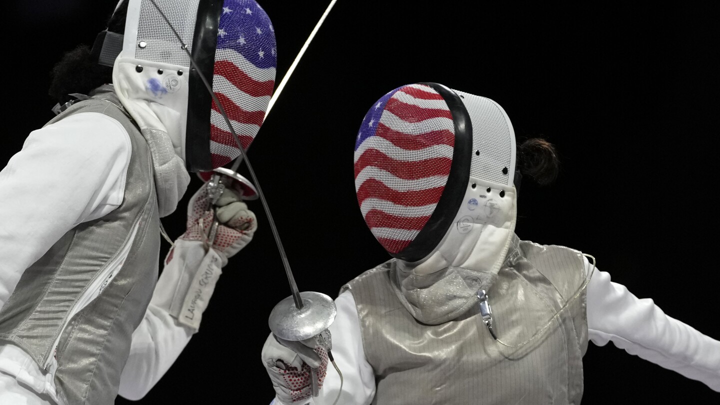 Kiefer earns 2nd Olympic gold in women's foil fencing with a victory over American teammate Scruggs