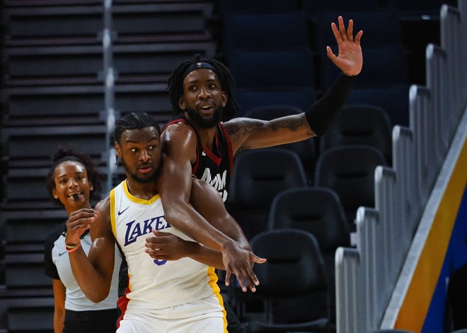 Bronny James battles with Miami Heat center Warren Washington during Wednesday's game.