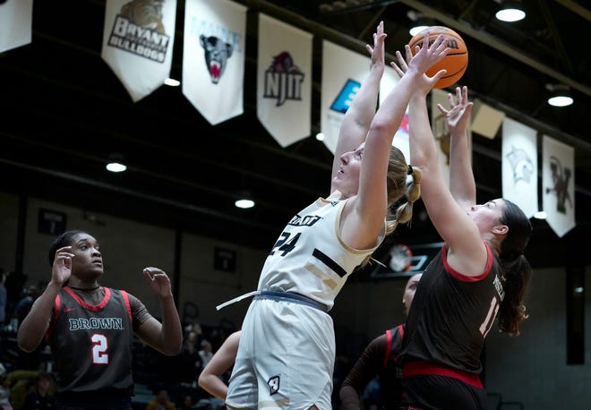 Bryant guard Megan Bodziony fights for a rebound during a game against Brown's Alyssa Moreland in November 2023. Bodziony will play for Le Moyne this coming season.