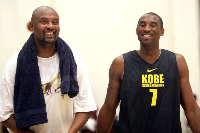 Joe "Jellybean" Bryant, shares a laugh with his son Kobe in a pickup basketball game at the Kobe Bryant Basketball Academy on Thursday, July 5, 2007. Joe Bryant died this month from a massive stroke.