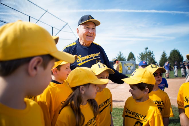 Baseball legend Johnny Antonelli gets a Little League team together for a photo during the Spencerport junior baseball and softball opening day at Spencerport High School on Saturday, May 2, 2015.