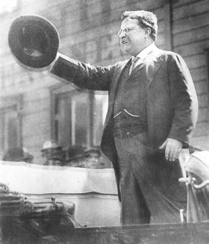 Former President Teddy Roosevelt greets a crowd on Milwaukee's south side on Oct. 14, 1912. Roosevelt, who was campaigning for president on a third-party ticket was shot later that day but survived - and managed to give his speech.