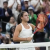 Emma Navarro of the United States celebrates after defeating compatriot Coco Gauff in their fourth round match at the Wimbledon tennis championships in London, Sunday, July 7, 2024.