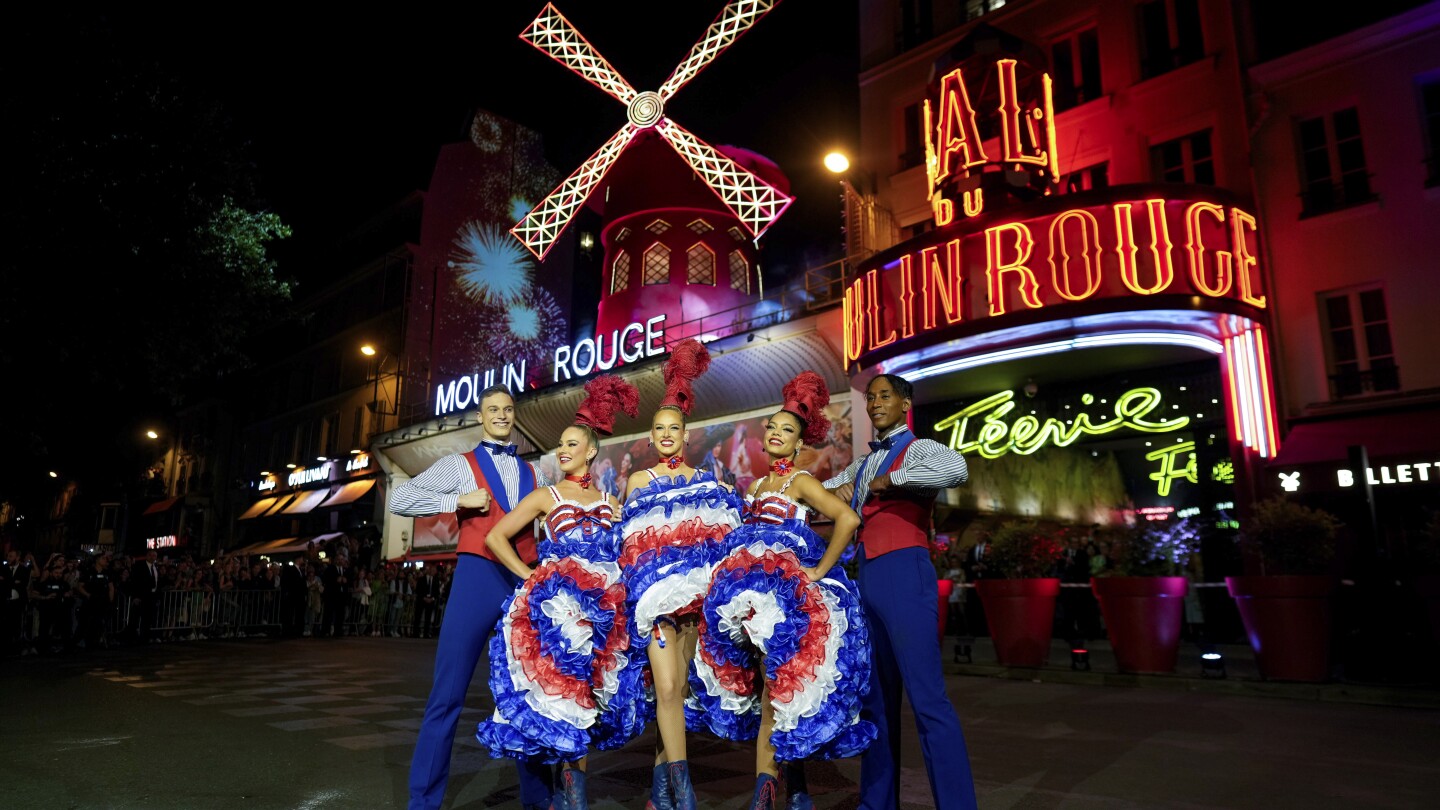 The Moulin Rouge cabaret in Paris has its windmill back, weeks after a stunning collapse